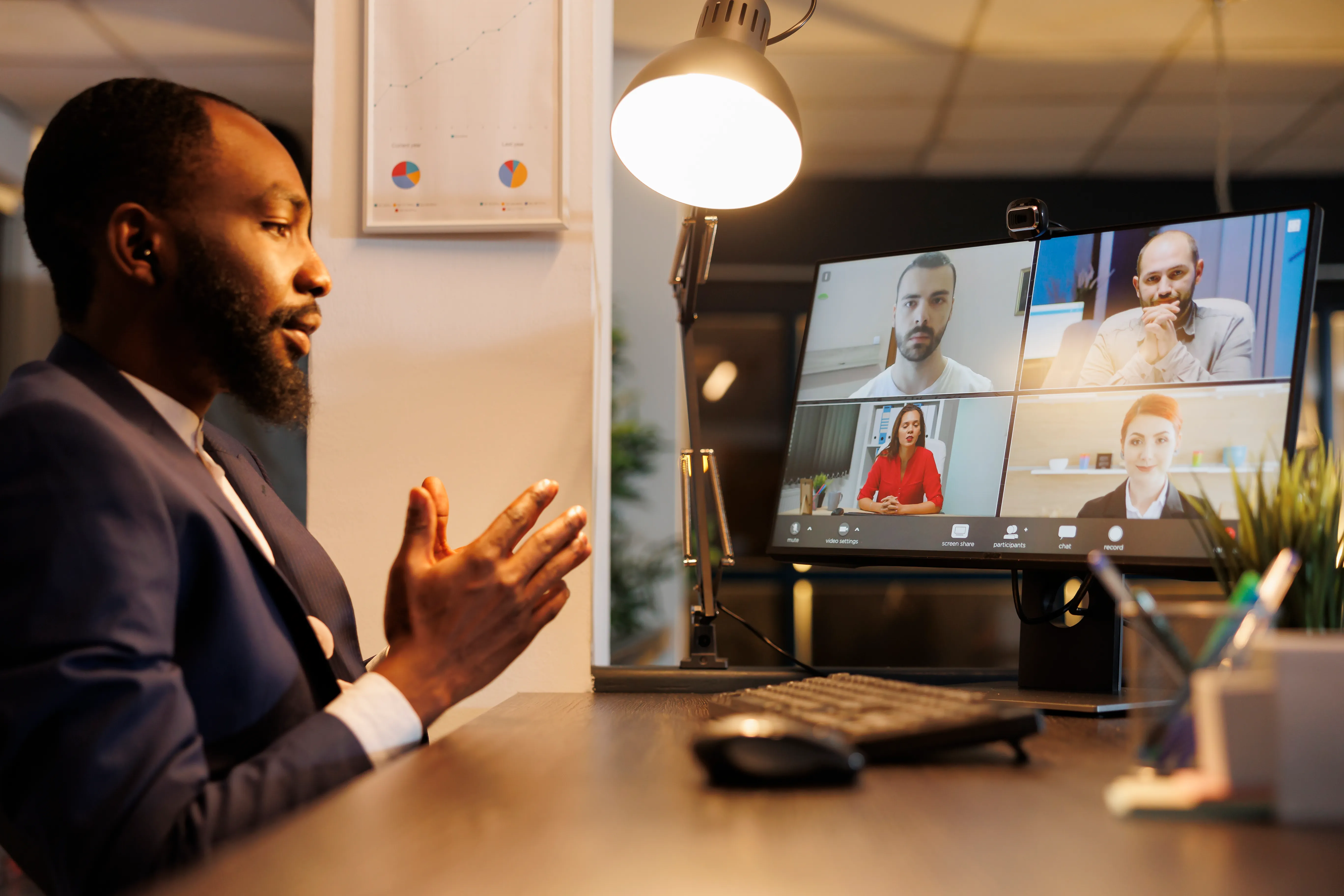 man in a business suit having a video conferencing session